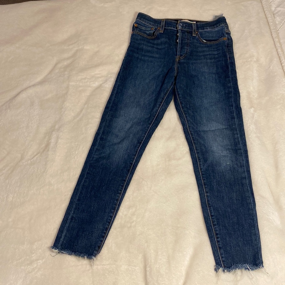 Levi’s dark wash blue jeans